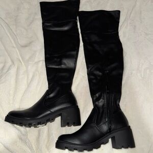 Over the knee lug sole boots.